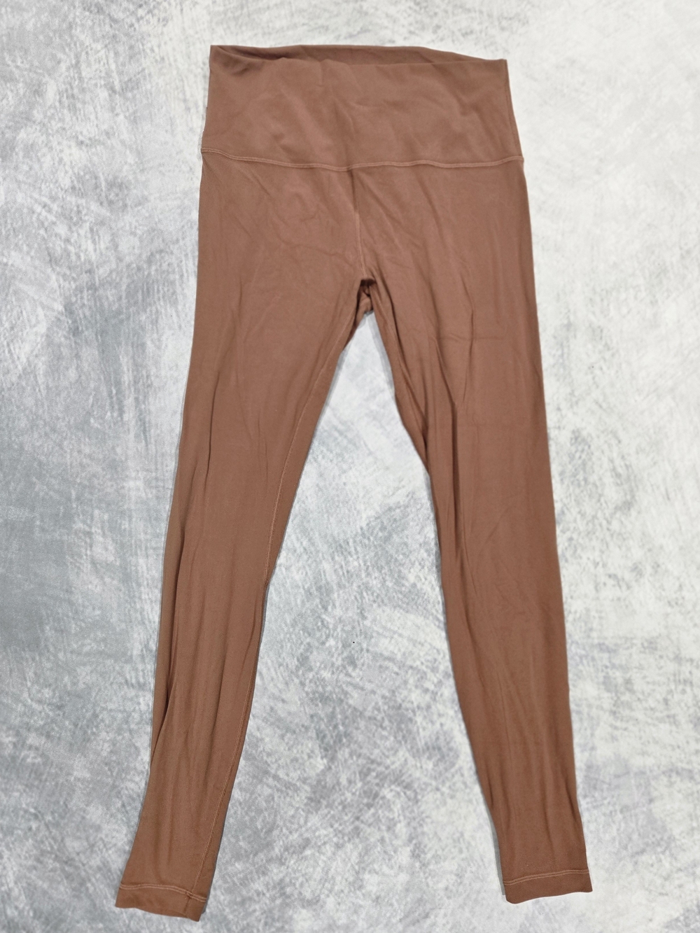 Lululemon high-rise leggings in a brown hue feature a seam-free
